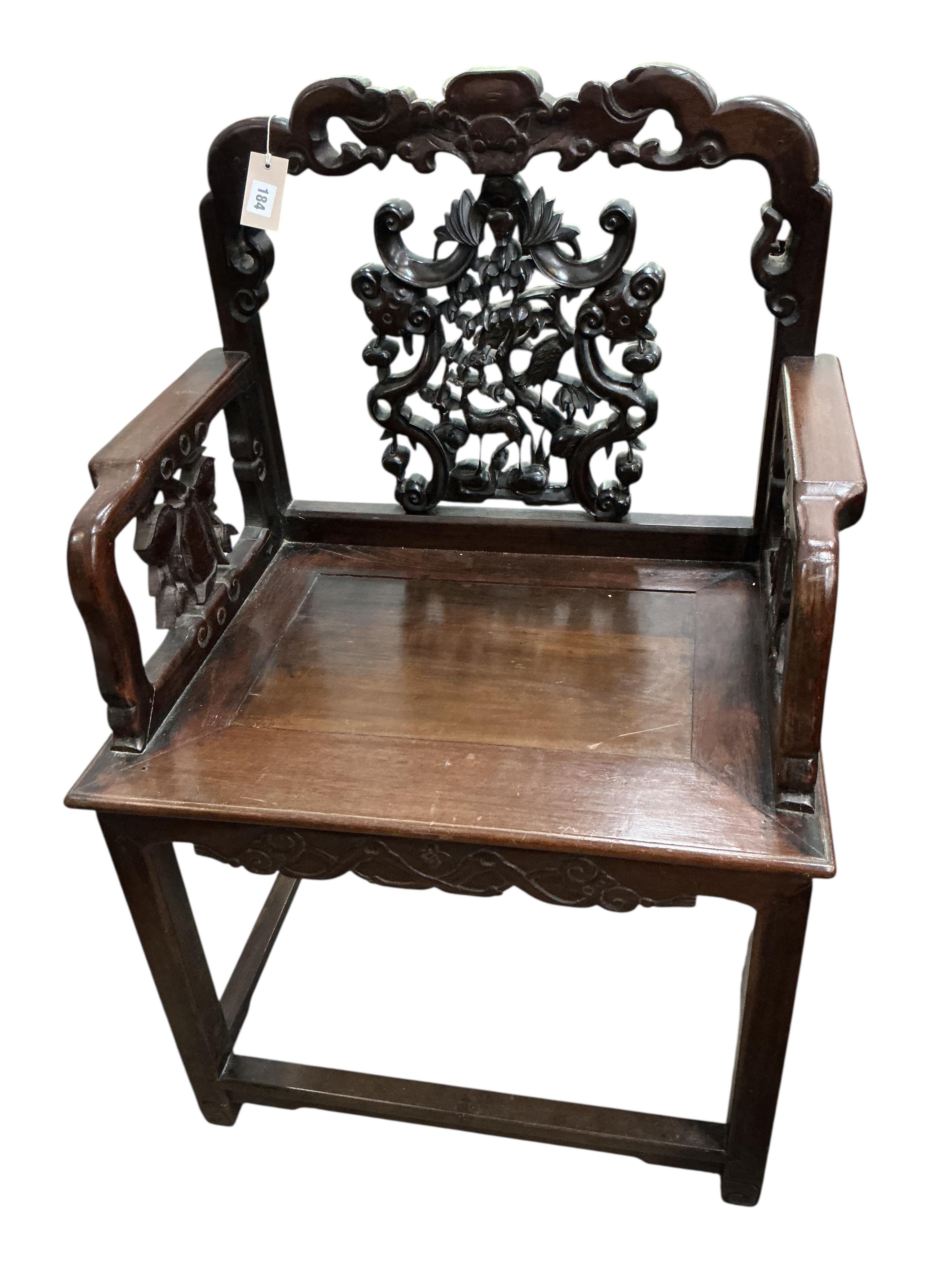 A near pair of Chinese Hongmu elbow chairs, width 64cm, depth 46cm, height 100cm